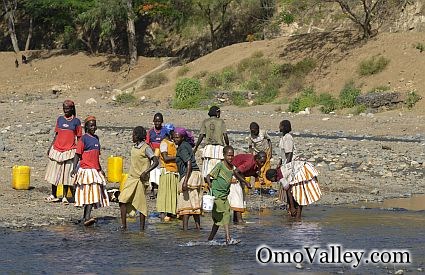 Tribal Women collecting water from the Omo River